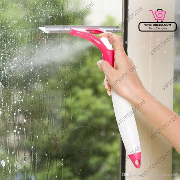 Person cleaning glass window with wiper and spray function.