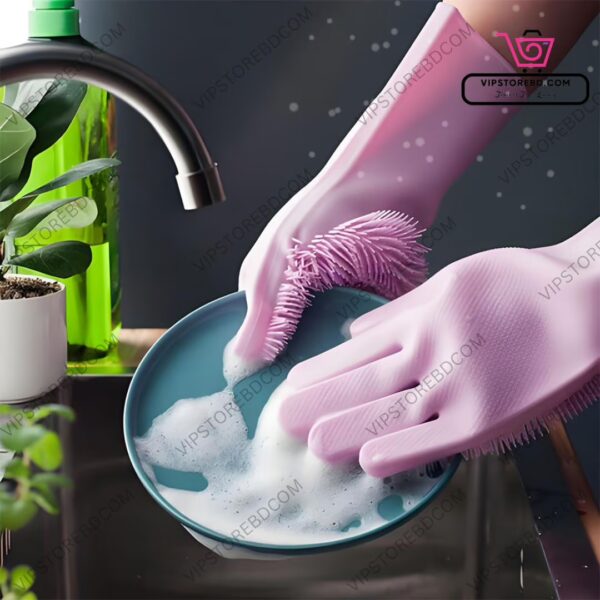 Silicone scrubbing gloves in action cleaning dishes with soap and hot water.