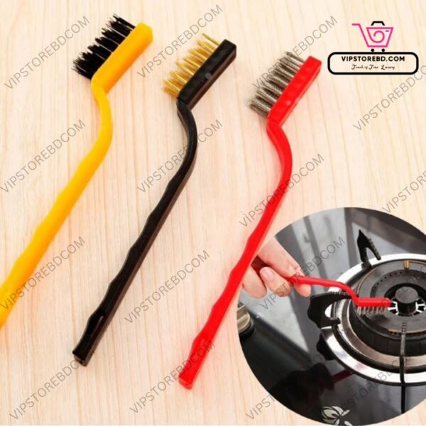 Wire brush scrubbing tile gaps and removing tough oil stains in kitchen.